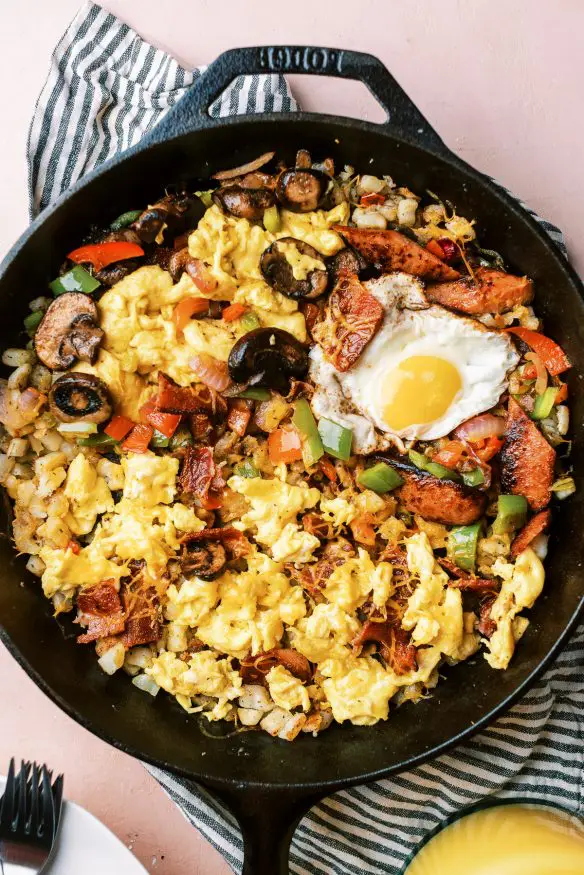 Country Style Breakfast Skillet, with over easy, scrambled and plant based egg, along with different meats and veggies for Mom, Dad and the kids!
