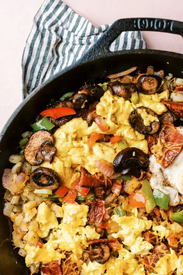 Country Style Breakfast Skillet, with over easy, scrambled and plant based egg, along with different meats and veggies for Mom, Dad and the kids!
