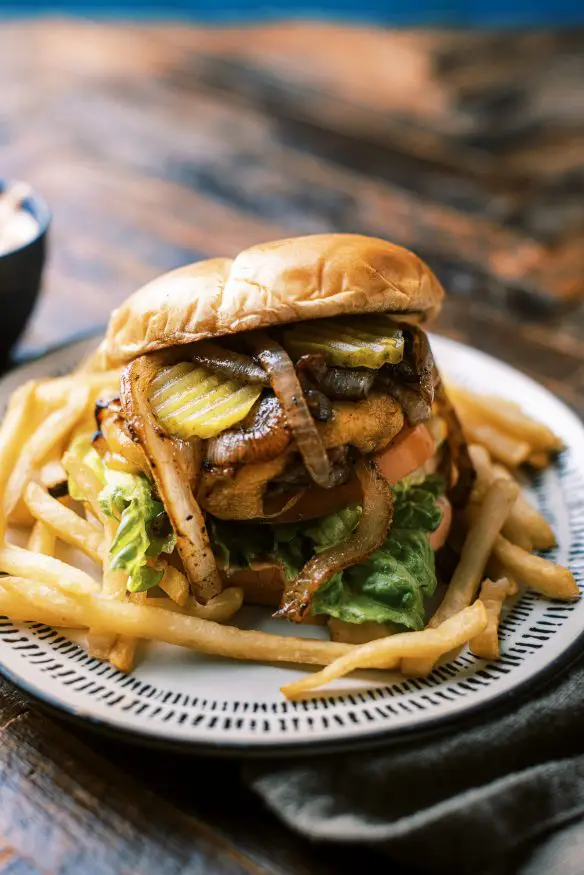 Mustard lined ground chuck, grilled onions and a secret sauce. These are all I need to make the best backyard grilled burger that is sure to be a crowd pleaser. 