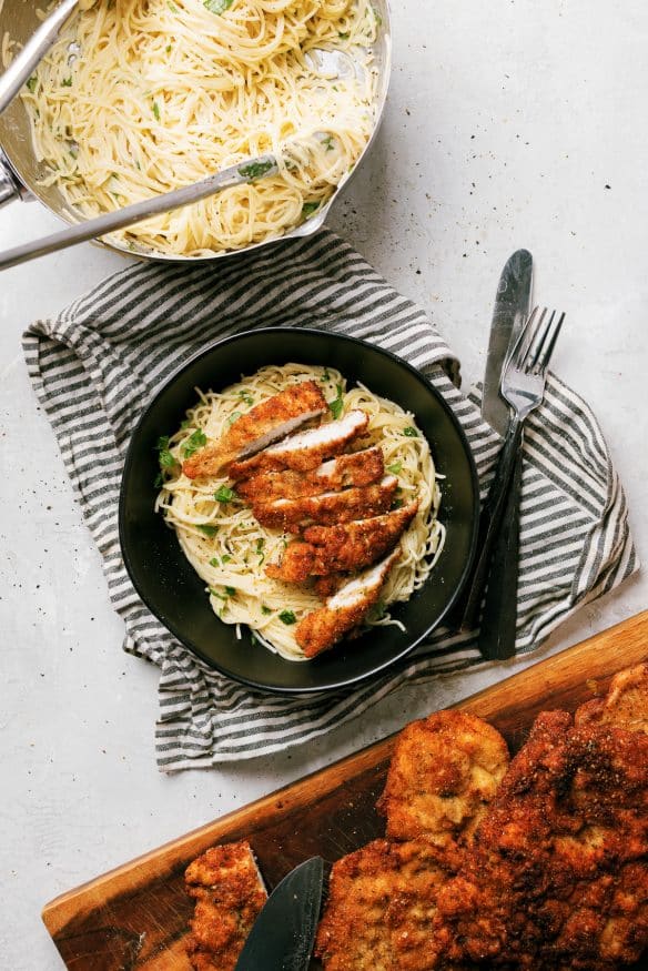 Cacio e pepe with pecorino Romano cheese topped with Italian seasoning breaded chicken cutlets - Italian comfort food at its best!