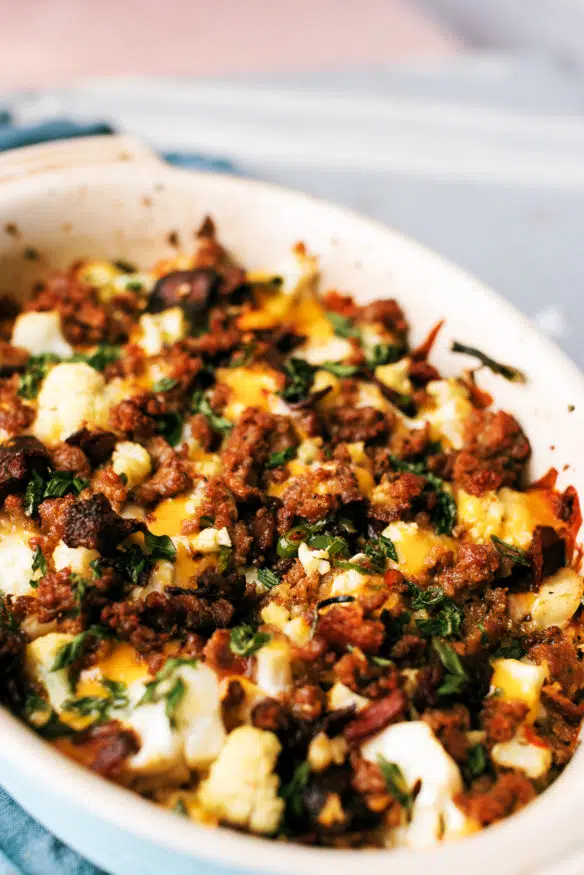 This loaded cauliflower casserole is loaded with cheese, scallions, sausage bacon and serrano peppers and perfect low carb side!