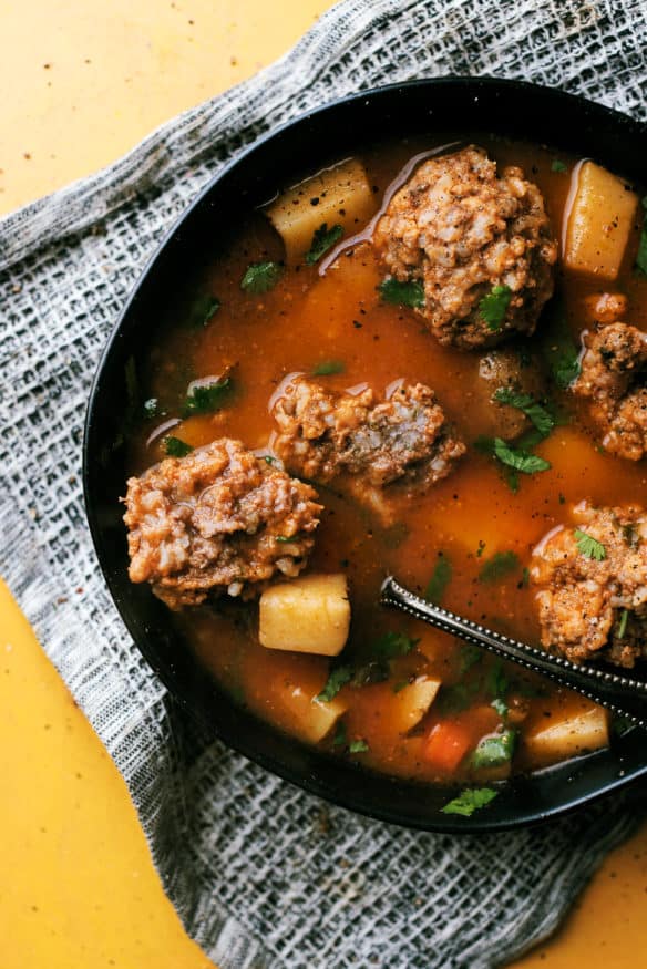 Albondigas is a meatball soup simmered in a tomato base broth flavored with a little cilantro. Kind of reminds me a little of a stew, but the flavor profile is insanely good!