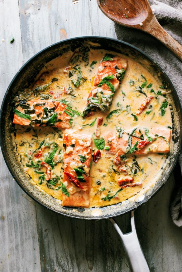 Tuscan Salmon is a creamy dish with a white wine based sauce, sun dried tomatoes, garlic and spinach. It’s rich and creamy, fully of robust flavor and best of all – done in a single pan. It’s Tuscan Salmon and its something you cannot pass up!