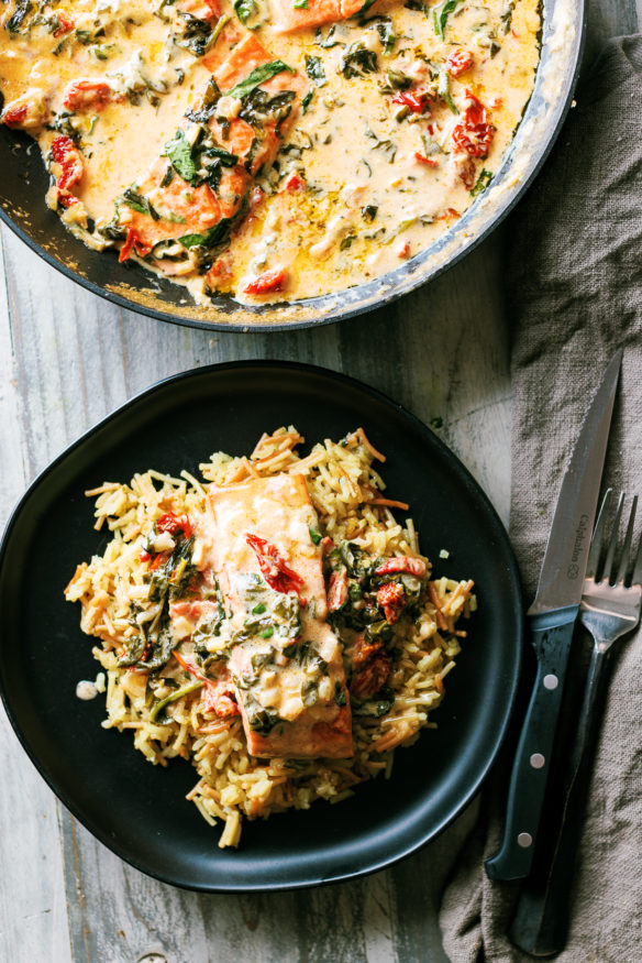 Make this Creamy Garlic Tuscan Salmon recipe in just 30 minutes! A one-pan meal with a rich parmesan sauce, sun-dried tomatoes & spinach.