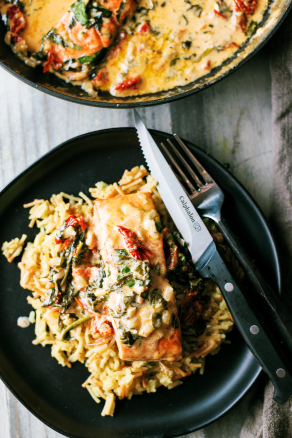 Tuscan Salmon is a creamy dish with a white wine based sauce, sun dried tomatoes, garlic and spinach. It’s rich and creamy, fully of robust flavor and best of all – done in a single pan. It’s Tuscan Salmon and its something you cannot pass up!