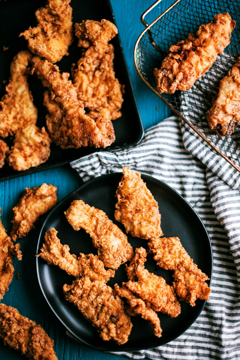 These spicy chicken tenders are marinaded overnight in buttermilk, then dipped in a flour dredge with Cajun seasonings, and fried to perfection. They freezable and makes the ultimate family dinner meal!