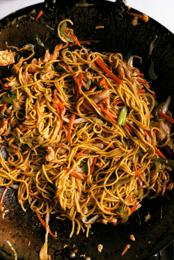 Chicken chow mein with a savory oyster and soy sauce. Includes step-by-step instructions with picture on how to cook chow mein in a wok