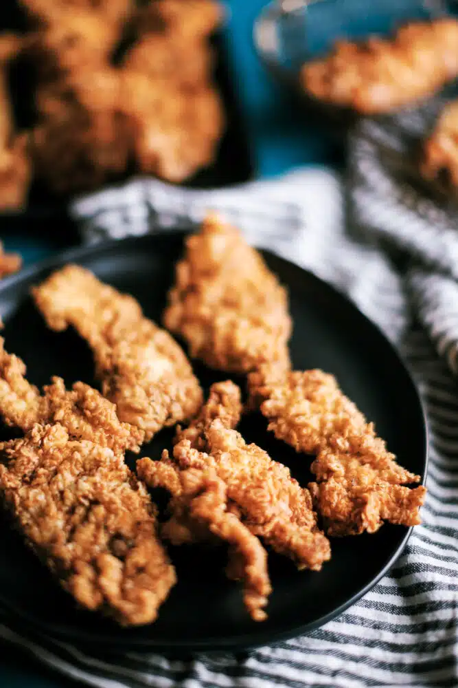 These spicy chicken tenders are marinaded overnight in buttermilk, then dipped in a flour dredge with Cajun seasonings, and fried to perfection. They freezable and makes the ultimate family dinner meal!