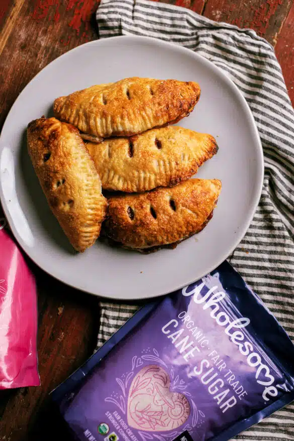 Apple cinnamon hand pies with a from-scratch all butter pie dough, and a deliciously sweet cinnamon apple filling.