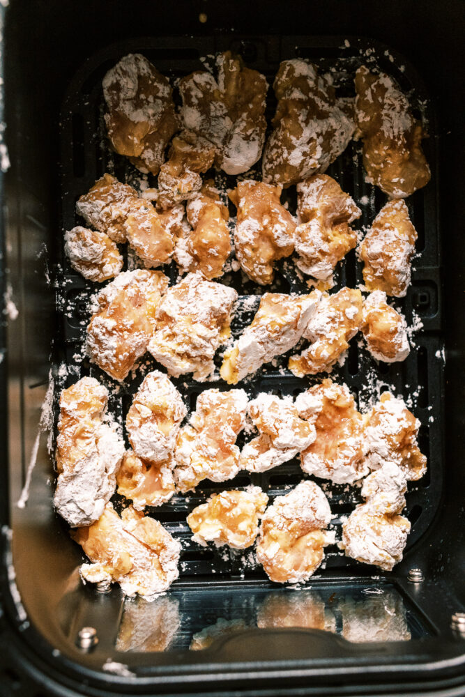 30-minute Air Fryer Bang Bang Chicken with crispy air-fried chicken bites, tossed in a spicy mayonnaise, sweet chili, and sriracha sauce